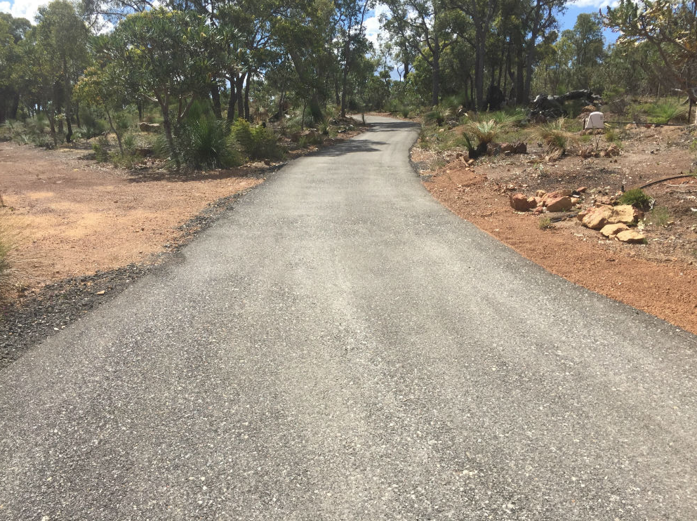 This is a photo of a hot spray & seal bitumen driveway which is in the process of being installed by Doncaster Road Tech